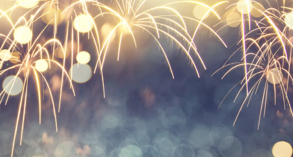 Fireworks explode with golden streaks and soft bokeh lights across a dark background; the word 'Fireworks' appears at the bottom.